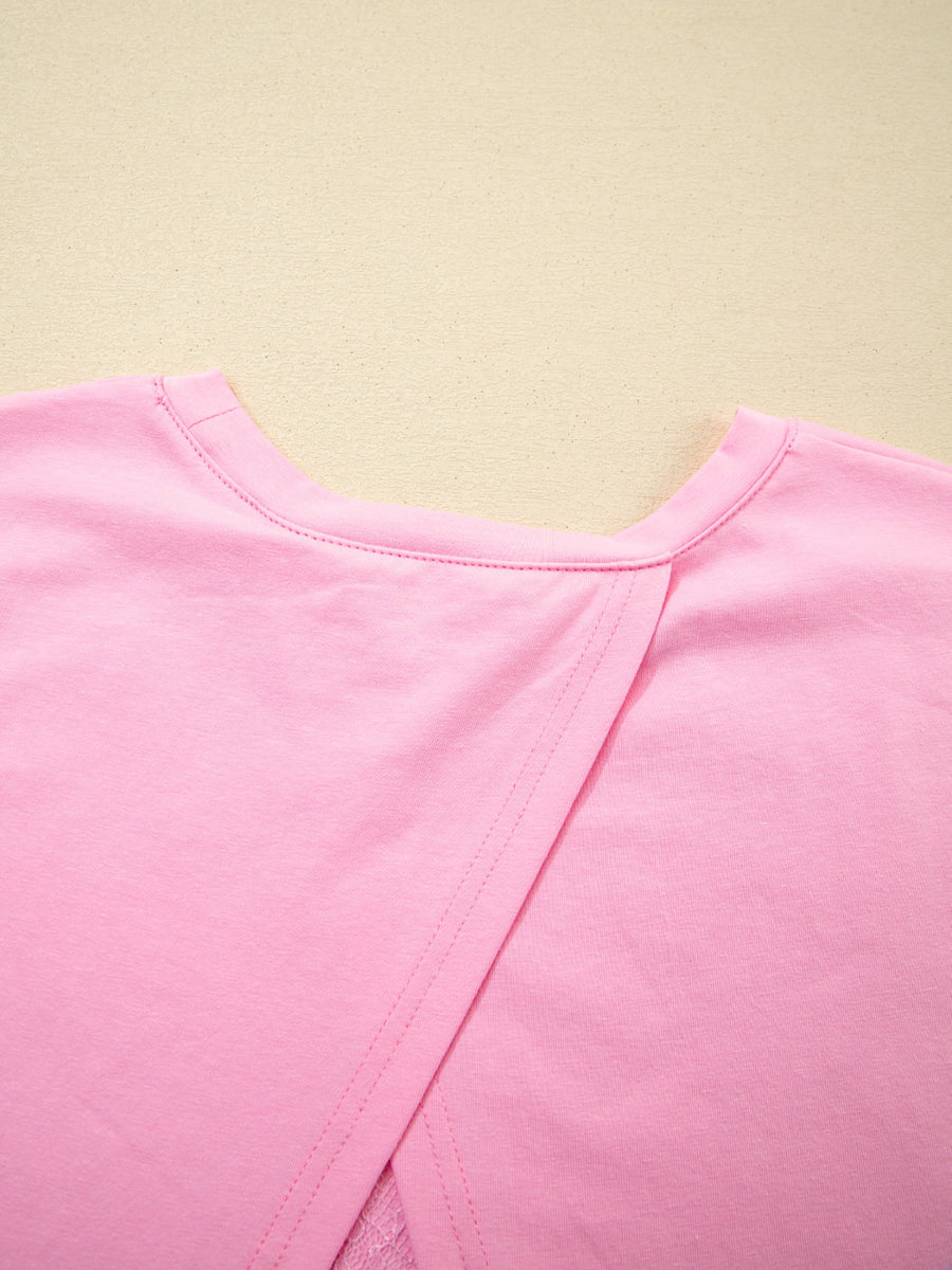 Pink cotton blend oversized tee with a crossover back detail.