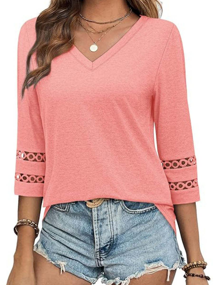 Pink V-neck t-shirt with 3/4 sleeves featuring cutout detail on cuffs.
