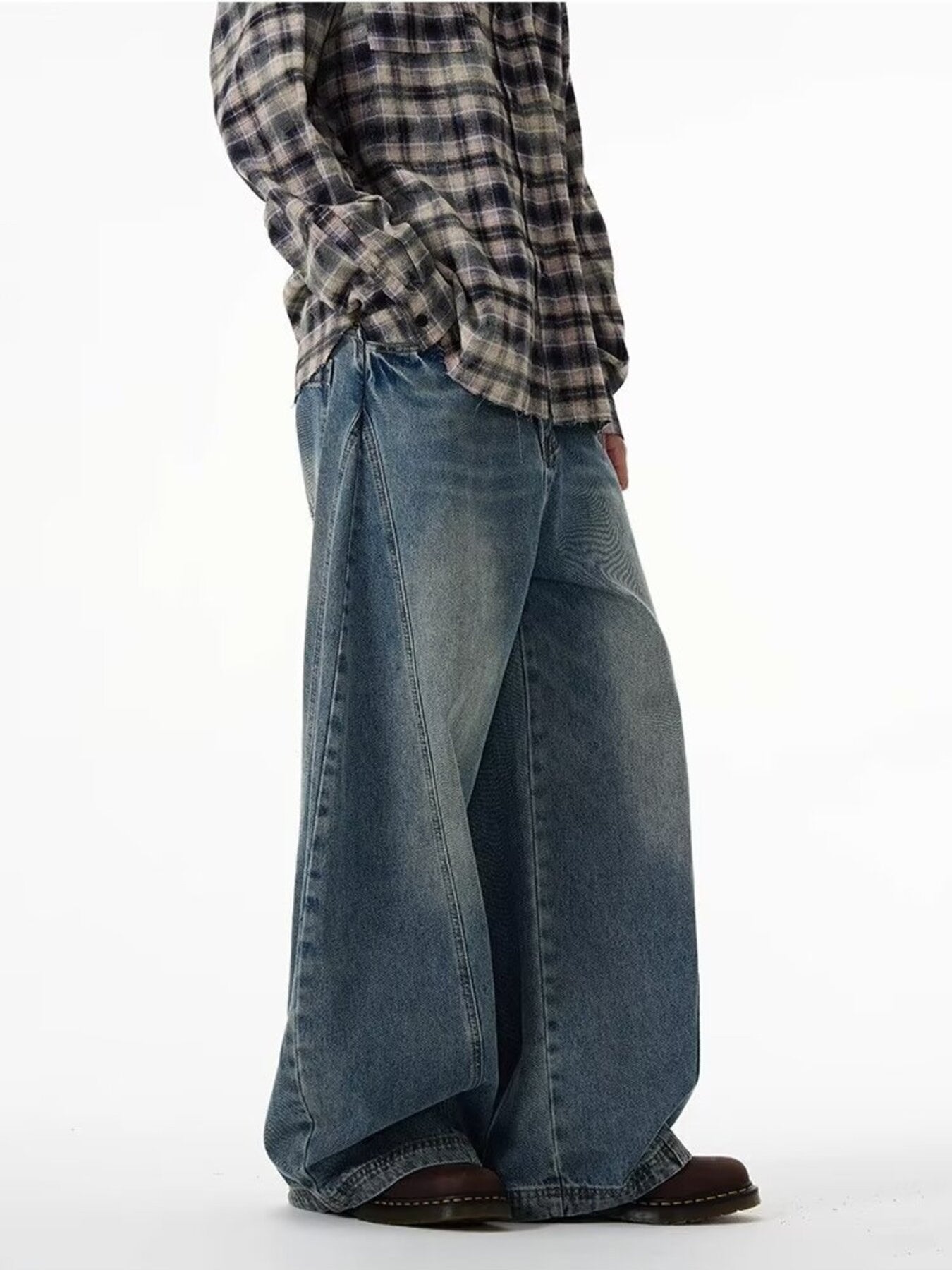 Men's blue cotton wide leg jeans with a relaxed fit.