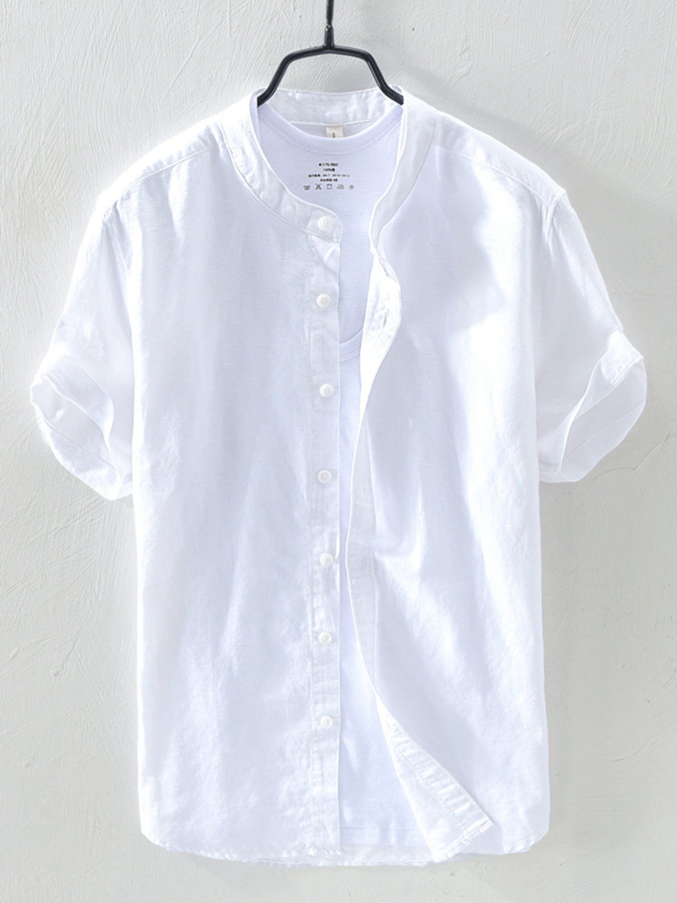 White linen short sleeve band collar shirt with button front
