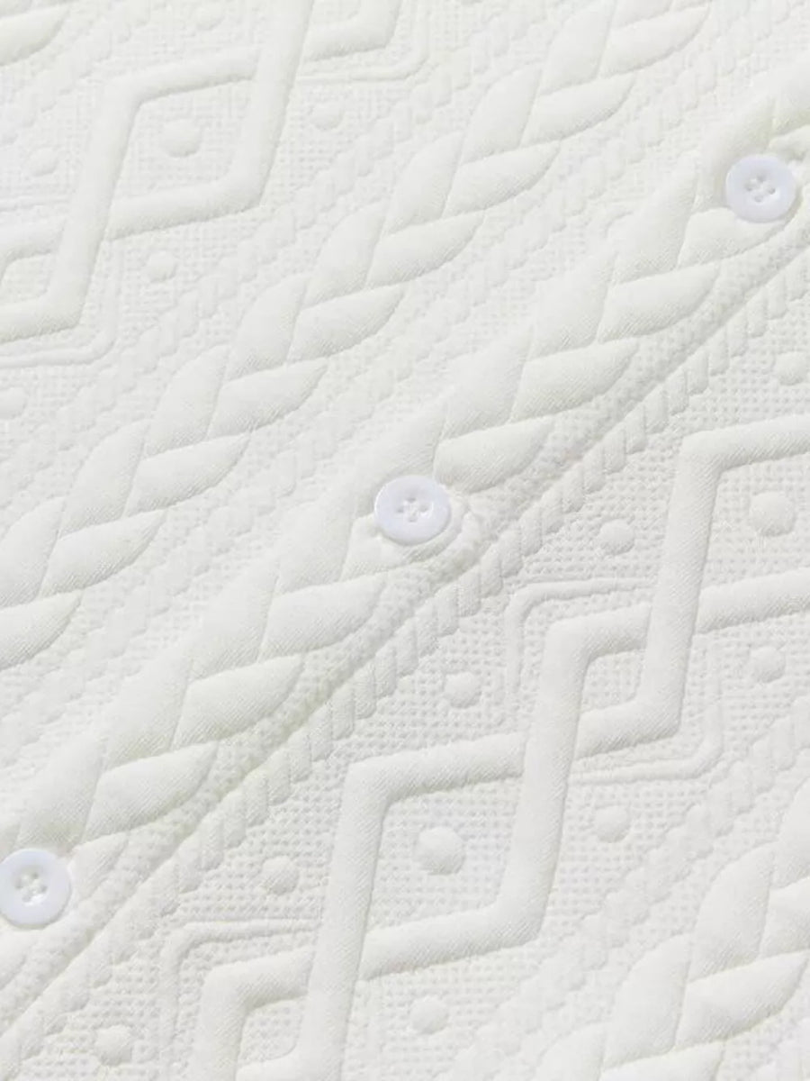 Off-white knit polo with textured geometric pattern and white buttons.
