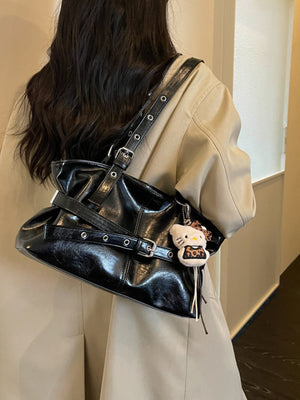 shoulder bag in black with adjustable strap and medium