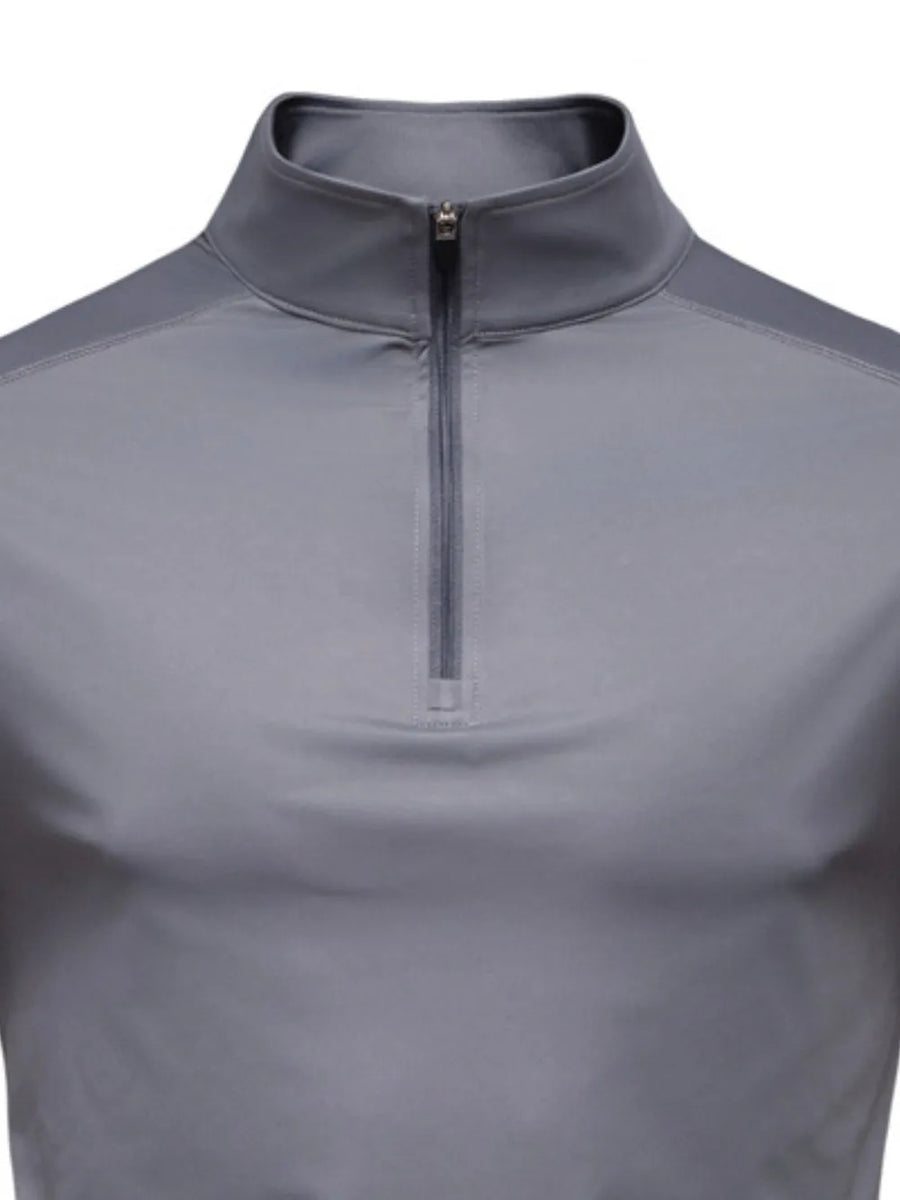 Gray performance zip-neck tee with structured shoulders and a stand-up collar.