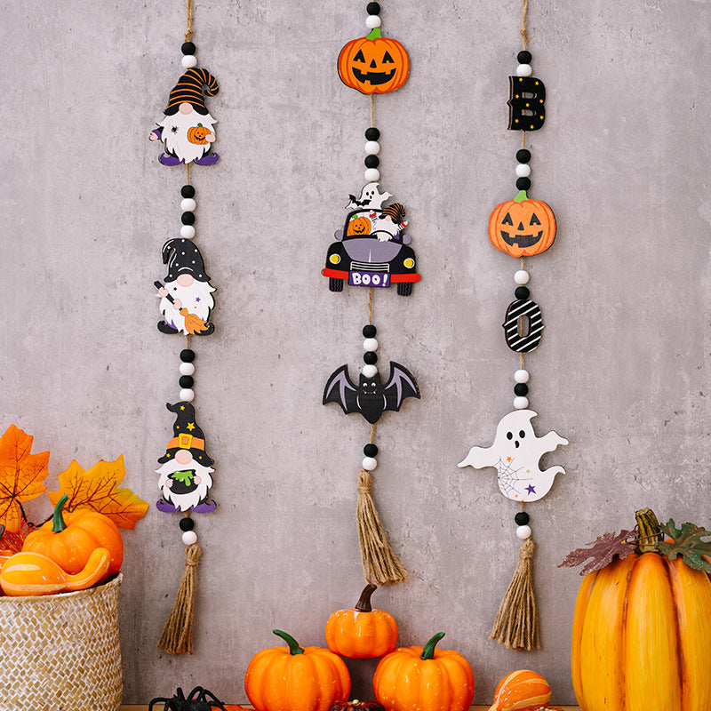 Halloween garland with gnomes, pumpkins, ghosts, bats, and "BOO!" car charms.