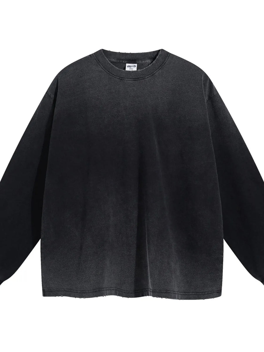 Vintage wash oversized crewneck sweatshirt in black with distressed hem and neckline.