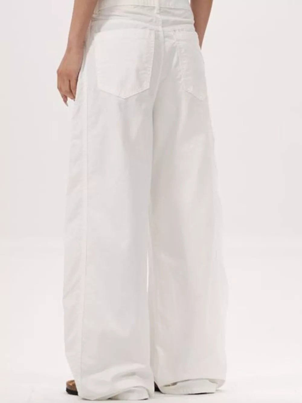 White wide-legged sweatpants with a relaxed fit and back pockets.