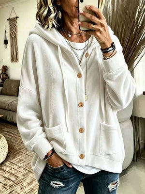 hoodie in white featuring buttoned and relaxed fit