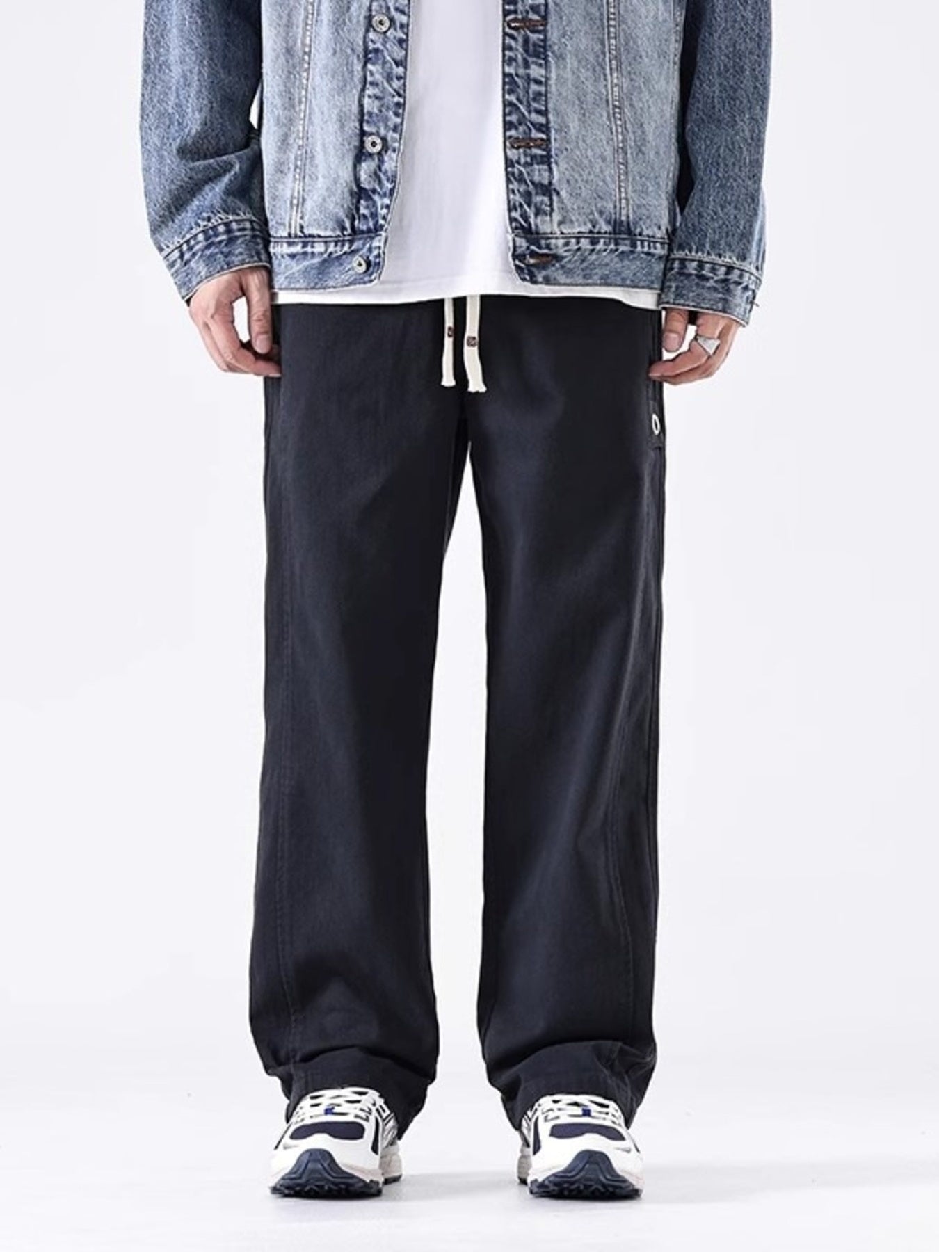 Men's black loose fit drawstring sweatpants with a relaxed cut.