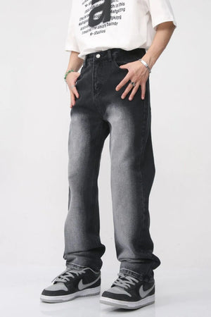 Faded wash baggy jeans in dark, relaxed fit denim with a gradient effect.