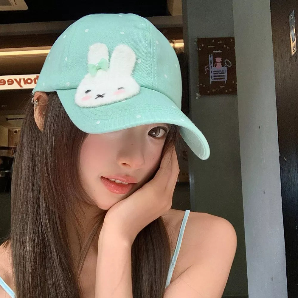 Pastel blue polka dot baseball cap with bunny applique and bow detail