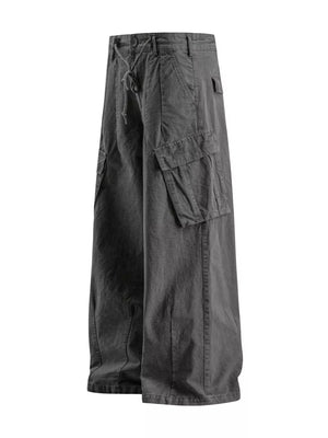 Grey wide-leg cargo pants with drawstring waist and multiple pockets