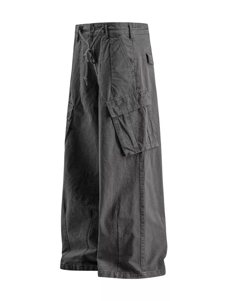 Grey wide-leg cargo pants with drawstring waist and multiple pockets