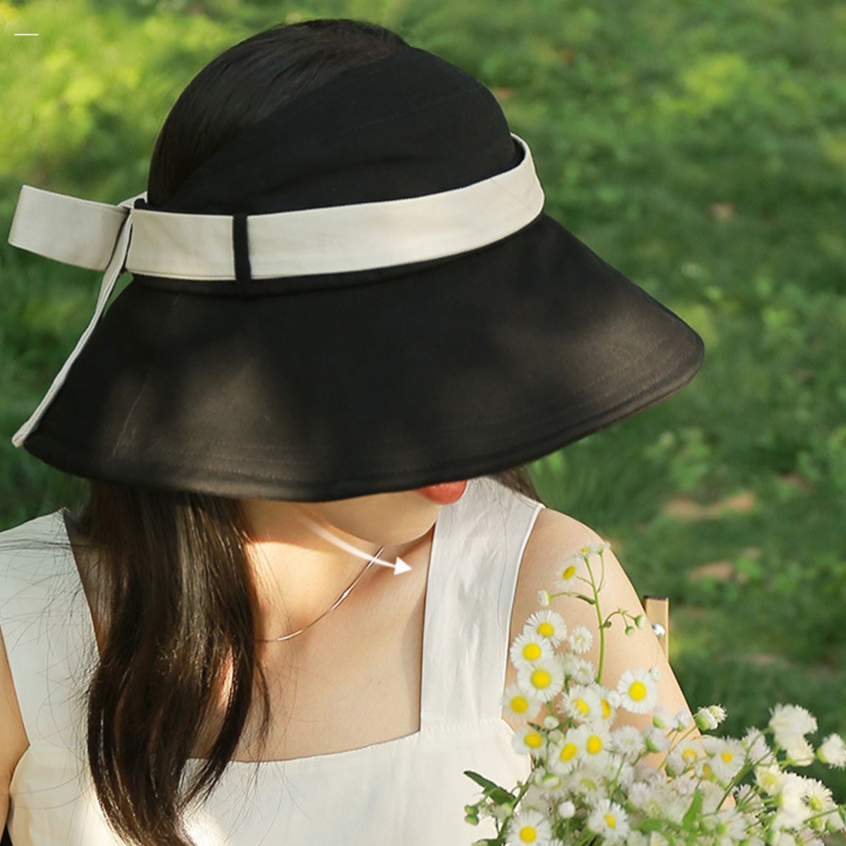 Black wide brim sun visor hat with white bow detail, cotton material