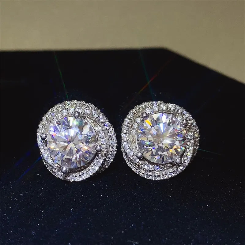 Halo diamond cluster stud earrings in silver with a bright, sparkling halo design.