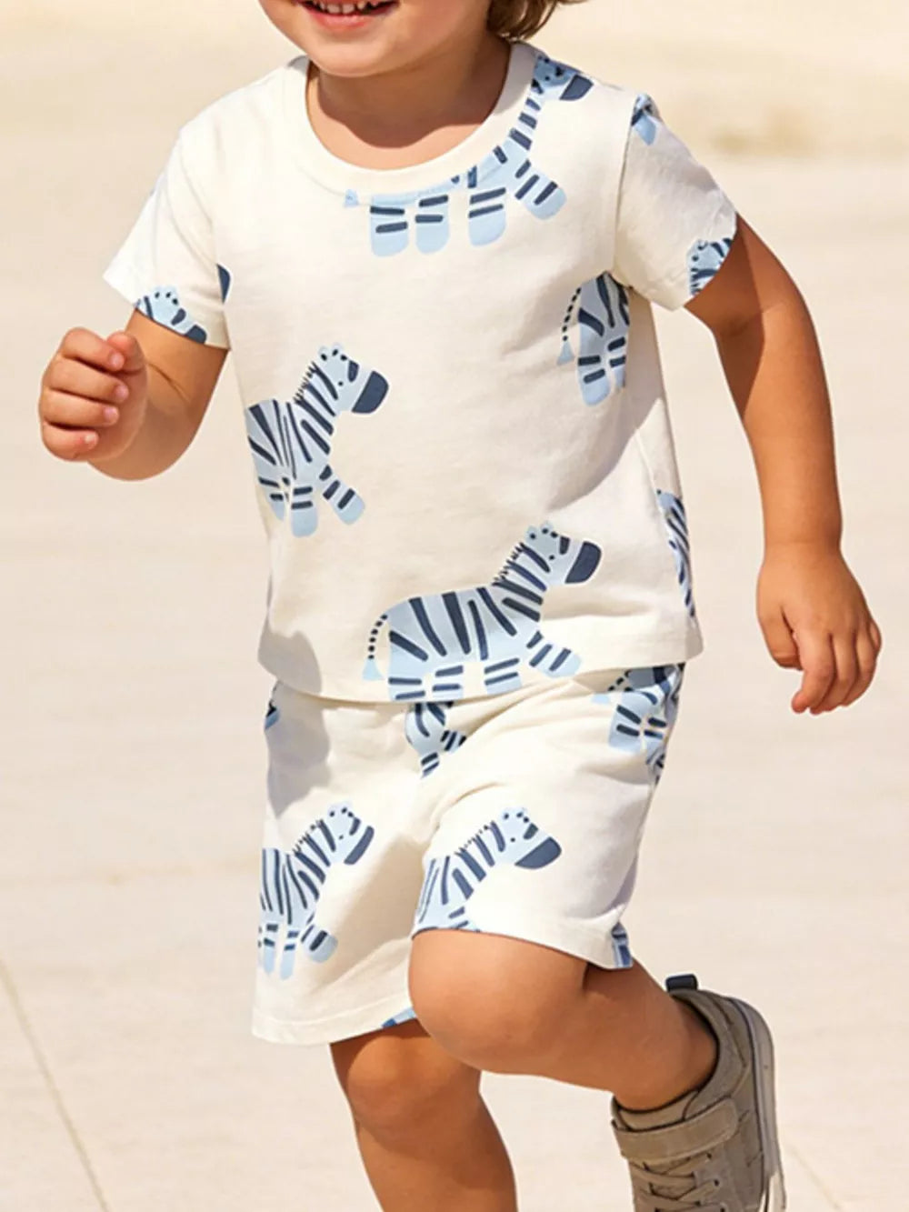 Toddler boys' cotton tee and shorts set with blue zebra print.