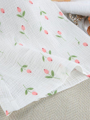 Floral print cotton robe with pink tulip pattern and green leaves on white gauze fabric.