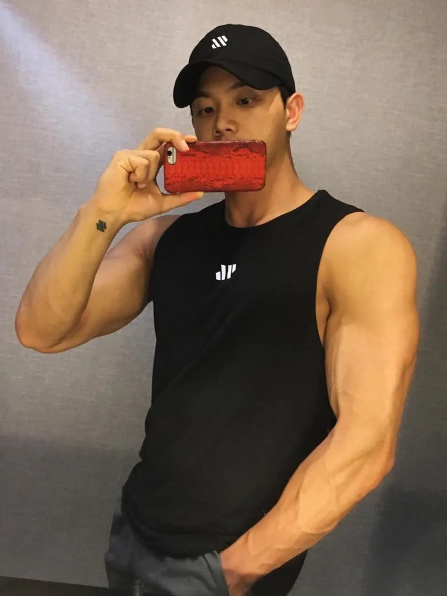 Black performance tank top with minimalist white branding and a crew neck.