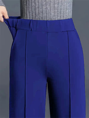 Blue high-waisted wide leg cotton trousers with pockets and a comfortable fit.