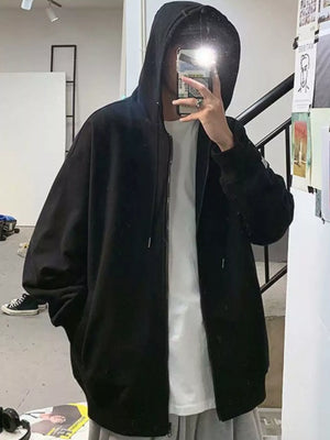 Black casual zip-up hoodie with a white t-shirt and gray sweatpants.