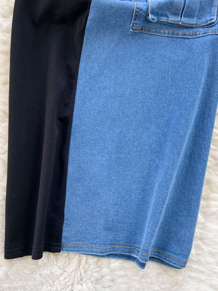 Color-block denim midi dress with utility pockets and black cotton panel.