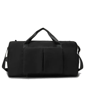 Black duffel bag with dual top handles, a detachable shoulder strap, and a front pocket with two compartments.