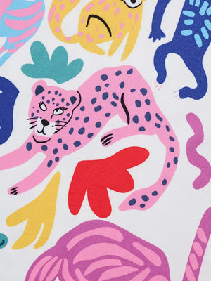 Fabric with a playful pink leopard print and abstract shapes in yellow, blue, and red.
