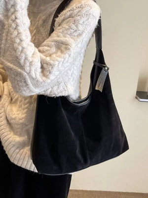 Black plush corduroy hobo shoulder bag with leather trim and strap