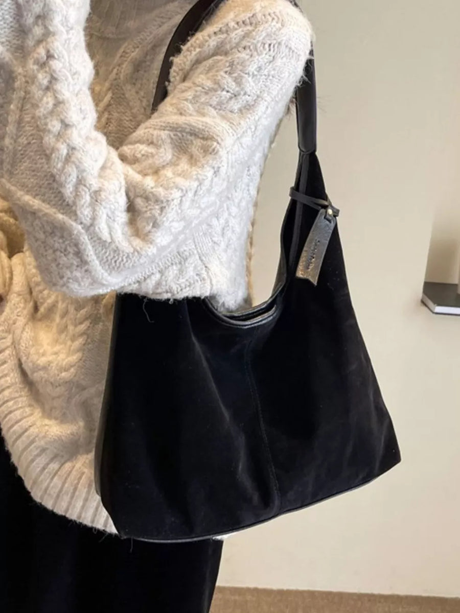 Black plush corduroy hobo shoulder bag with leather trim and strap