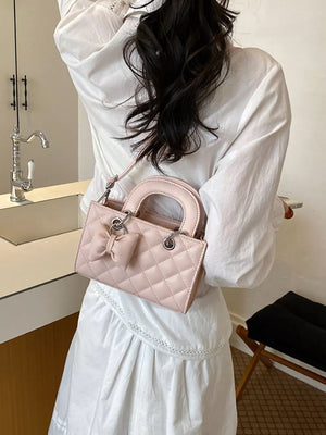 crossbody bag in blush pink with quilted and mini