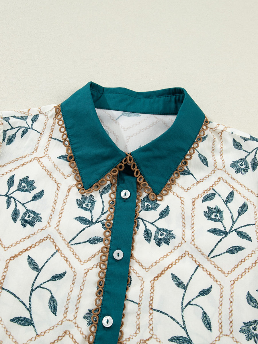 Floral print cotton mini dress with a teal polo collar and button front.
