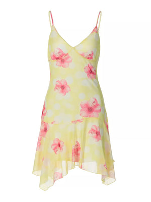 Yellow floral asymmetrical mini dress with ruffled hem and polka dots.
