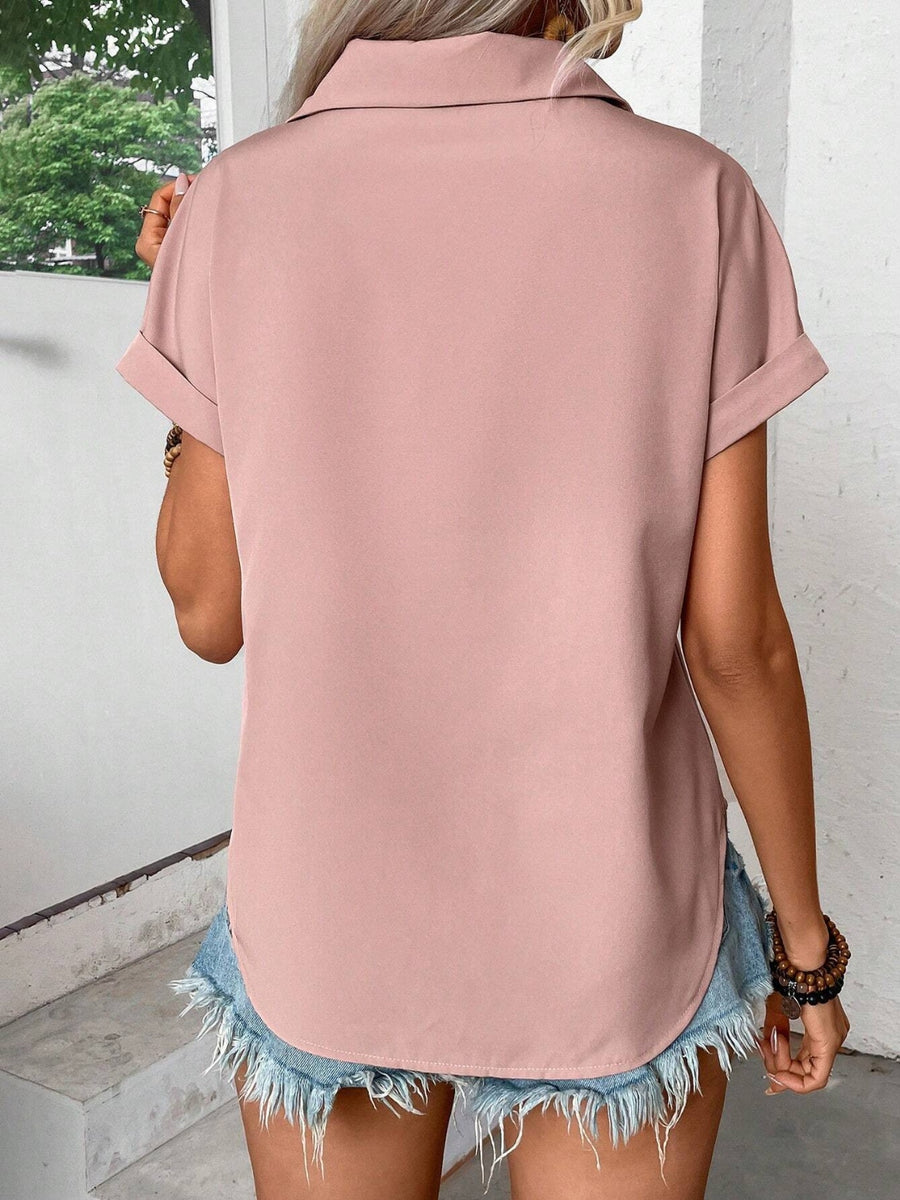 Dusty pink polyester button-down shirt with cuffed short sleeves and a curved hem.