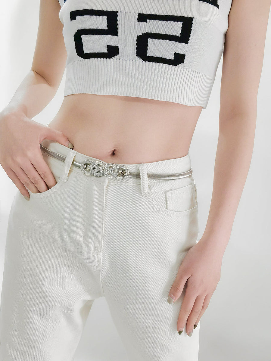 Silver intertwined knot waist belt with a thin metallic strap.