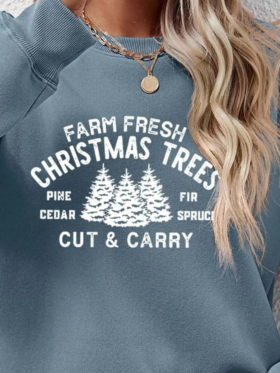Graphic print crewneck sweatshirt in Misty Blue with "Farm Fresh Christmas Trees" text and pine trees graphic.
