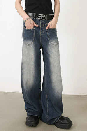 Faded wash palazzo jeans in medium blue denim with a relaxed fit and wide leg.