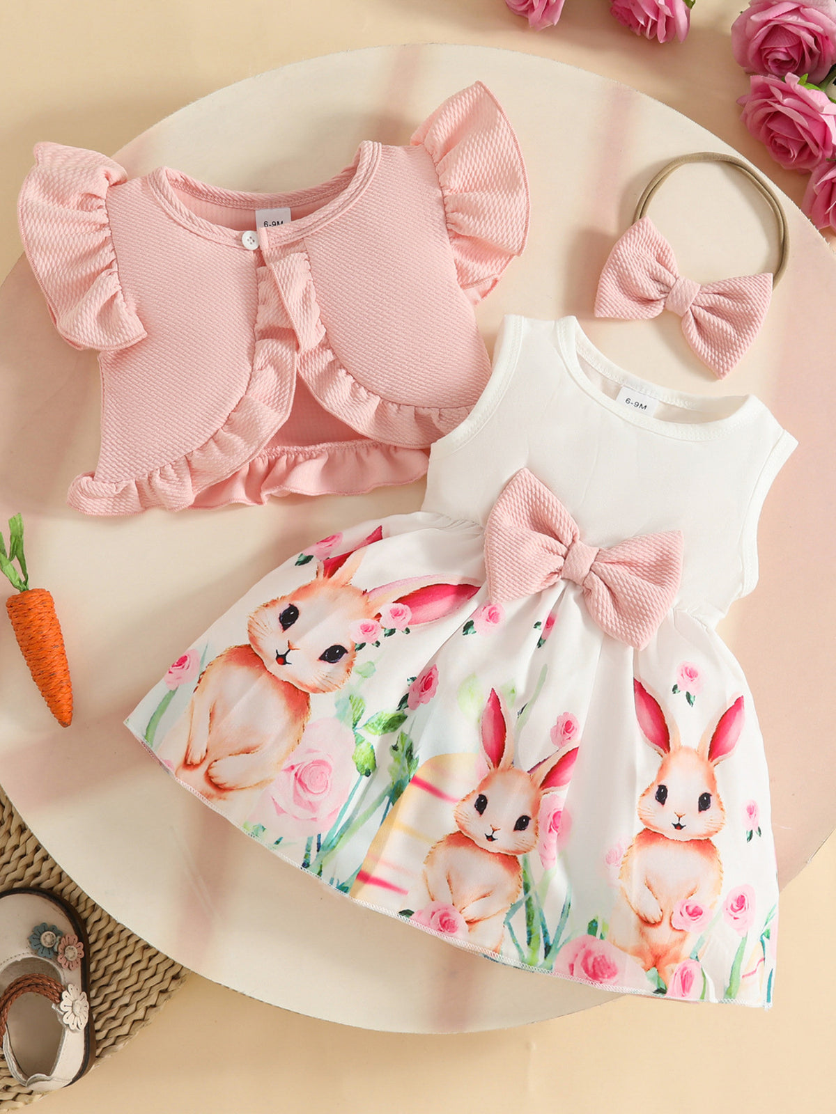 Baby dress with bunny print and pink ruffle cardigan set with bow detail.