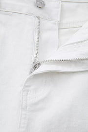 White denim jeans with zipper detail and button closure