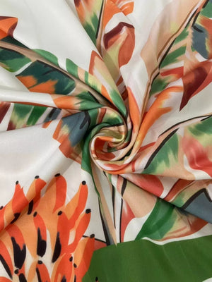 Tropical print maxi dress fabric with cutouts and a slit detail.