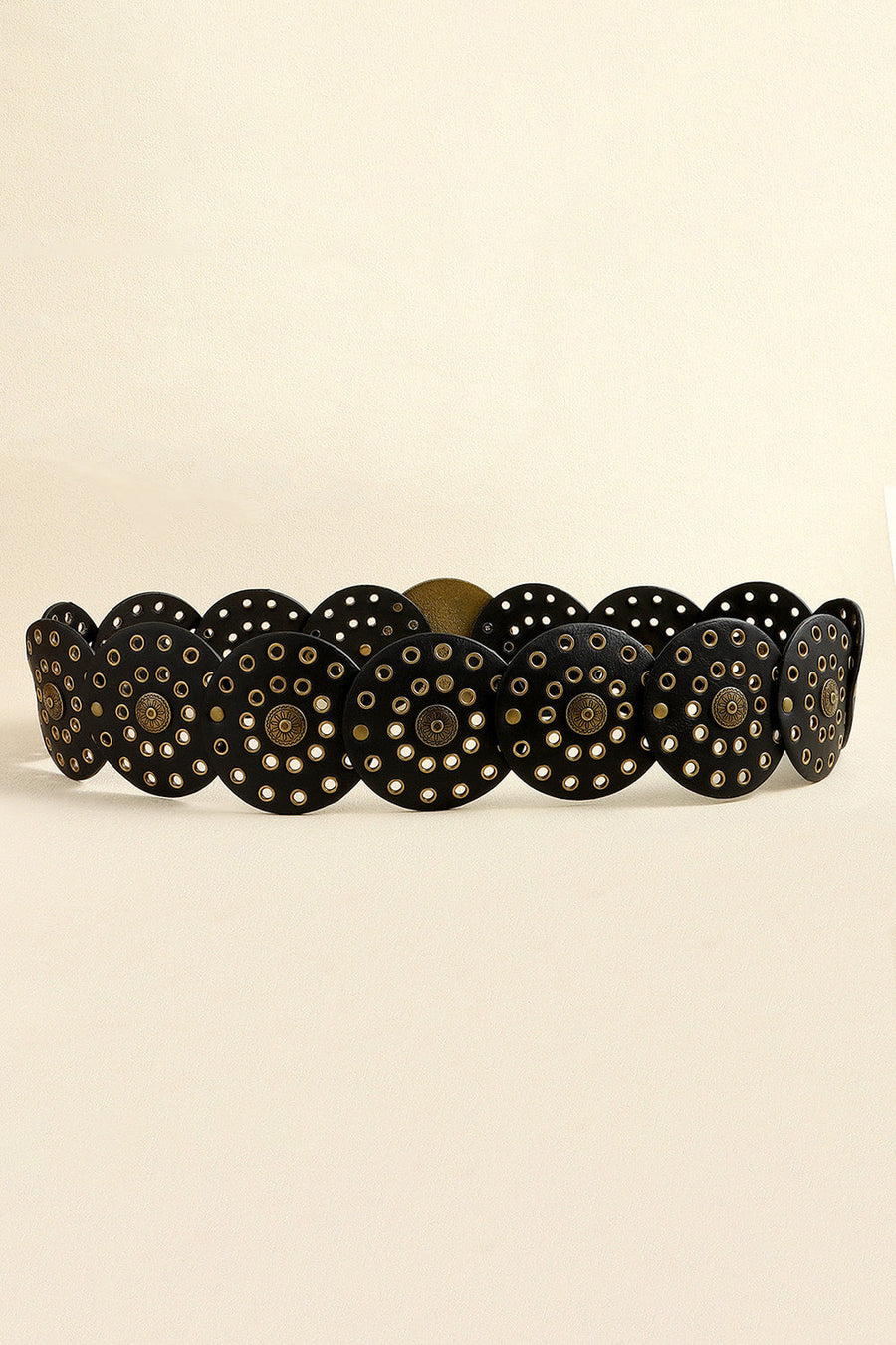 Black leather belt with scalloped edge and gold disc embellishments.