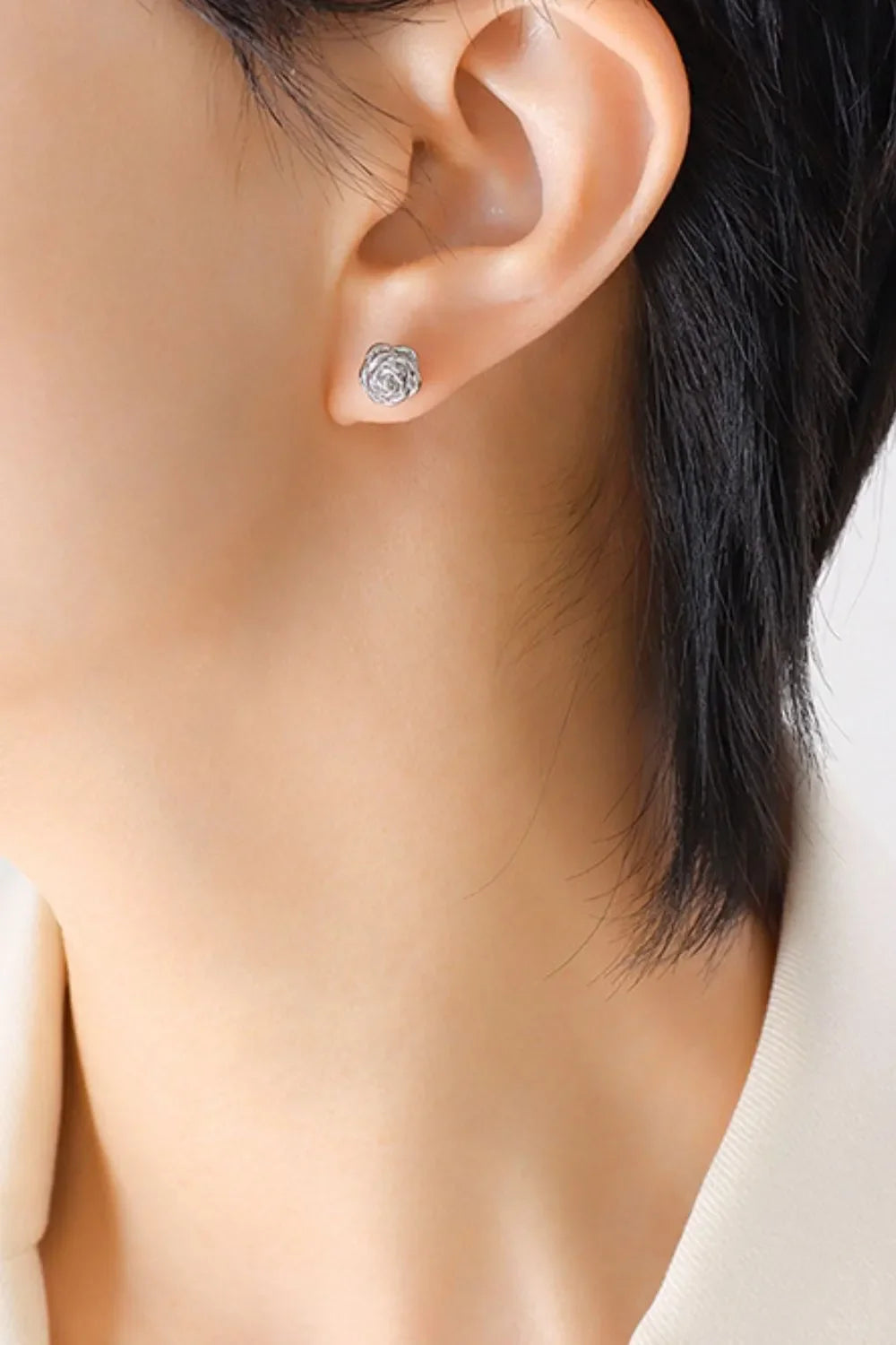 Sculpted rosebud stud earrings in silver, 18K gold-plated detail.