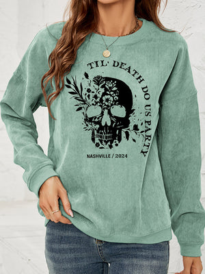 Gum Leaf corduroy sweatshirt with floral skull graphic and text.