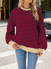 Striped crew neck sweatshirt in red and navy with tan trim and cuffs.