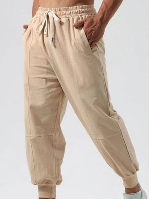 Khaki relaxed fit joggers with seam details and adjustable drawstring waist.