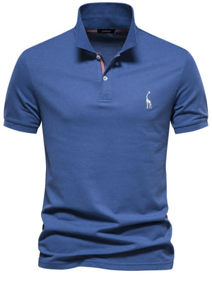 Blue piqué polo shirt with giraffe embroidery and striped collar detail.