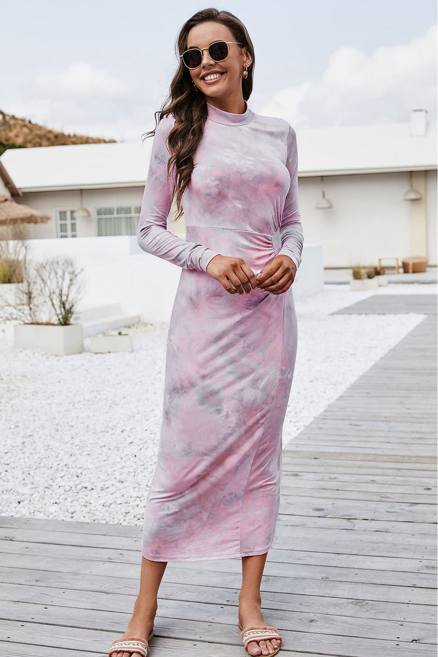 Tie-dye ruched midi dress with mock neck in blush pink, long sleeves, and a side slit.