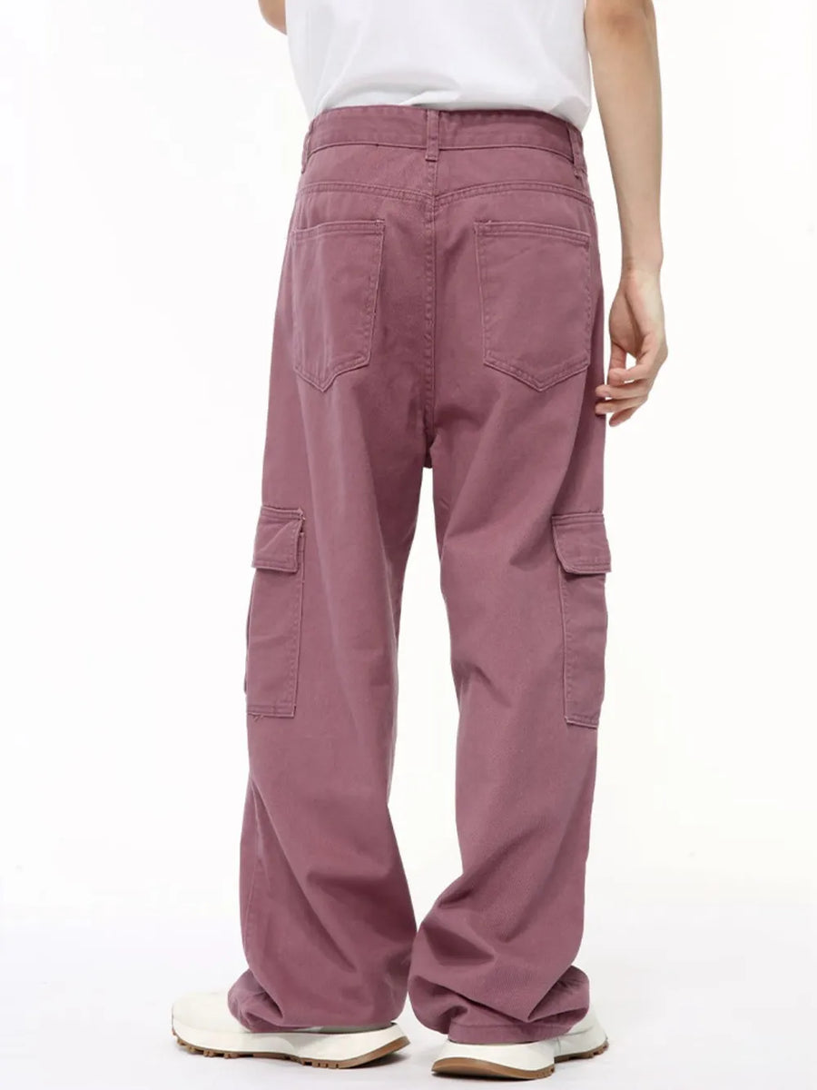 Oversized cargo denim trousers in Dusty Pink with multiple pockets and a relaxed fit.