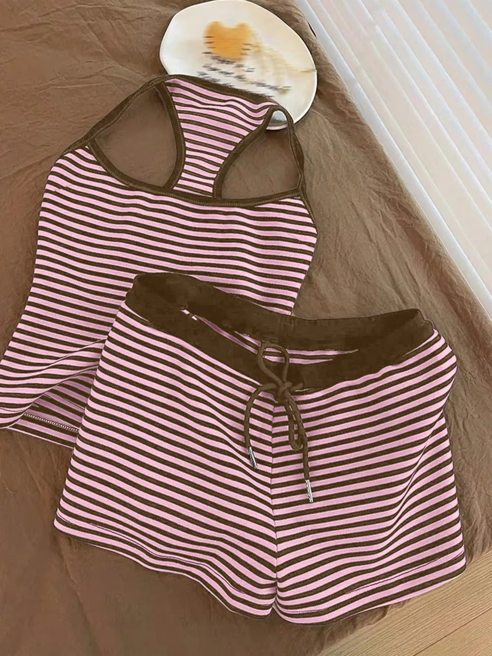 Pink striped tank top and drawstring shorts set with brown trim.