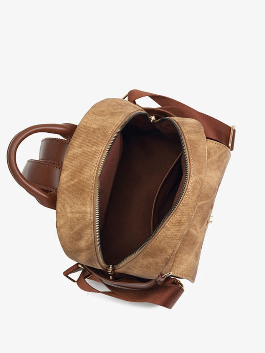Caramel canvas mini backpack with brown leather details and adjustable straps, open view.