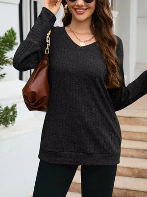 Textured V-neck knit long-sleeve top in gray, featuring a relaxed fit and subtle vertical ribbing.