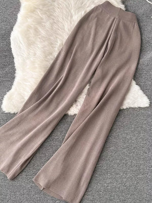 Khaki knit wide leg pants with a tied waist detail.